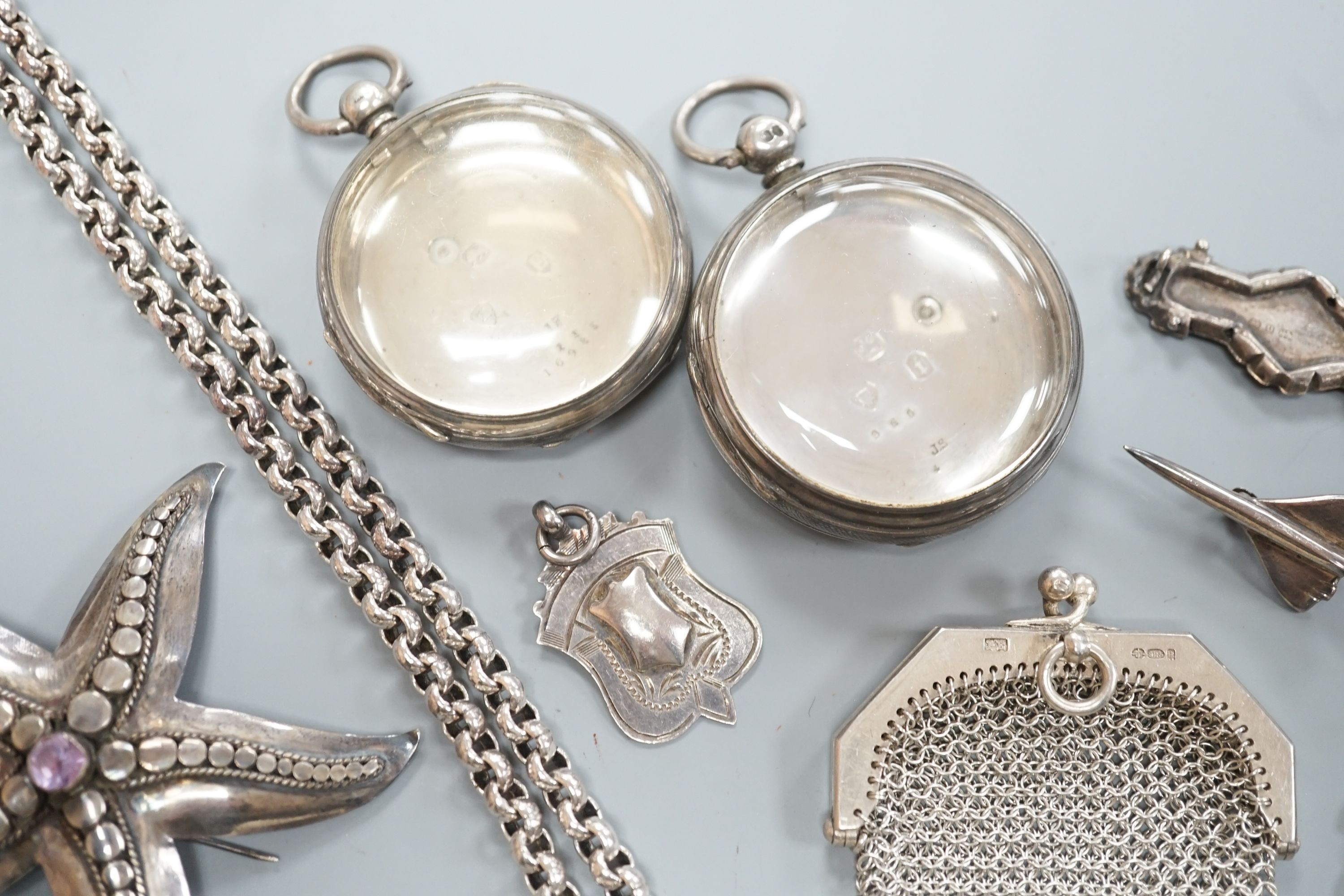 A small group of mainly silver and white metal jewellery including belcher chain, brooches, medallions, evening purse etc. and two silver pocket watch cases.
